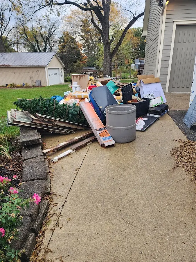 Dumpster being loaded with debris for Commercial Dumpster Rental in Indian Wells